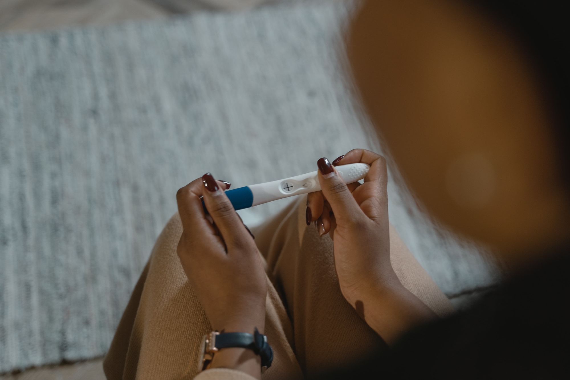 Woman holding a pregnancy test kit