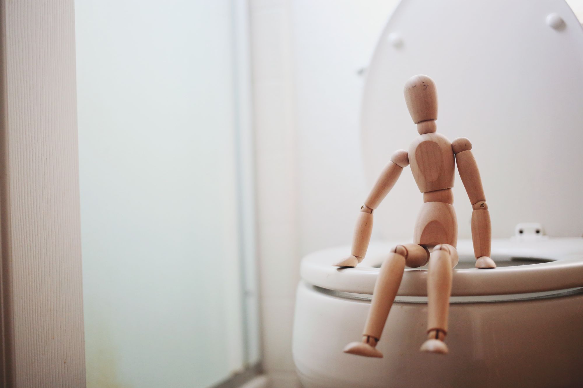 Sitting on the water closet bowl